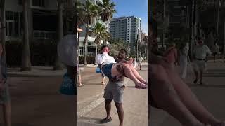 Big Black Guy lifts up Chubby White Girl in arms