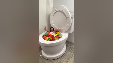 Going UNDER in Worlds Largest Toilet with Sports Balls #shorts