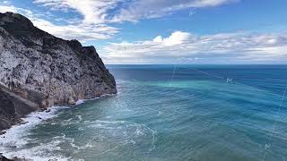 Breathtaking aerial image showcasing lively surf and breathtaking sky reflections on rocky ledges Breathtaking aerial image showcasing lively surf and breathtaking sky reflections on rocky ledges