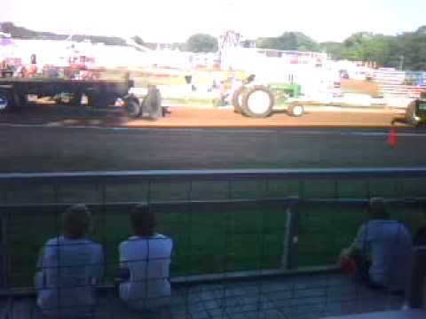 A Clip made at the 2010 Polk County Fair in WI. of a John Deere Tractor pull that went at least half way,the 2 kids at the end of the clip are my 2 Sons who share,my entusiasiem for Tractor Pulls