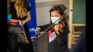 Simple device helps determined young violinist