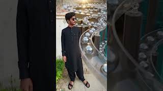 Prompt: "Hyper-realistic 3D rendering of infinite looping silver balls smoothly flowing down.