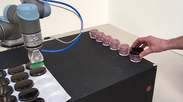 Lid placing with robot