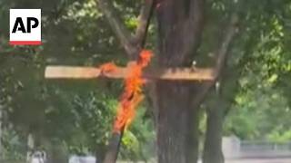 Police are investigating a large burning cross at a Chicago park