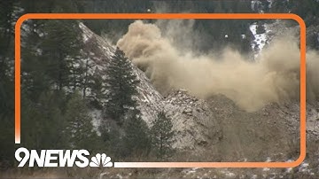 CDOT workers gather to watch rock scaling blast as I-70 Floyd Hill project continues
