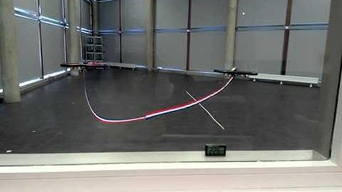 Cooperation of multiple quadrotors for transporting a flexible payload