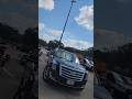 Cadillac Escalade tries to back small trailer and does this