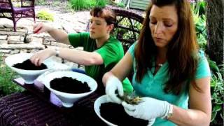 Shawna Coronado and her assistant, Kate Szekely, demonstrate how to make a strawberry or vegetable planter from a light fixture. It 