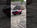 RC Truck Bouncing on a Boulder by the River