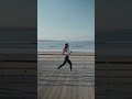 Young Lady Jogging Along the Coastline