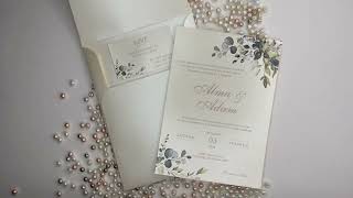 Beautiful ivory, gold and green botanical wedding invitation card and envelope with a classic touch.