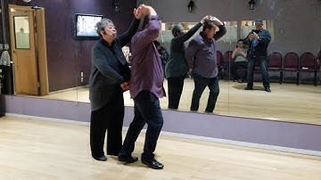 Salsa with Juan does the pretzel lock