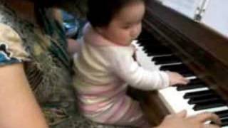 Chloe playing piano 7/10/07