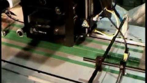 Label Printer Applicator applying labels to flat products