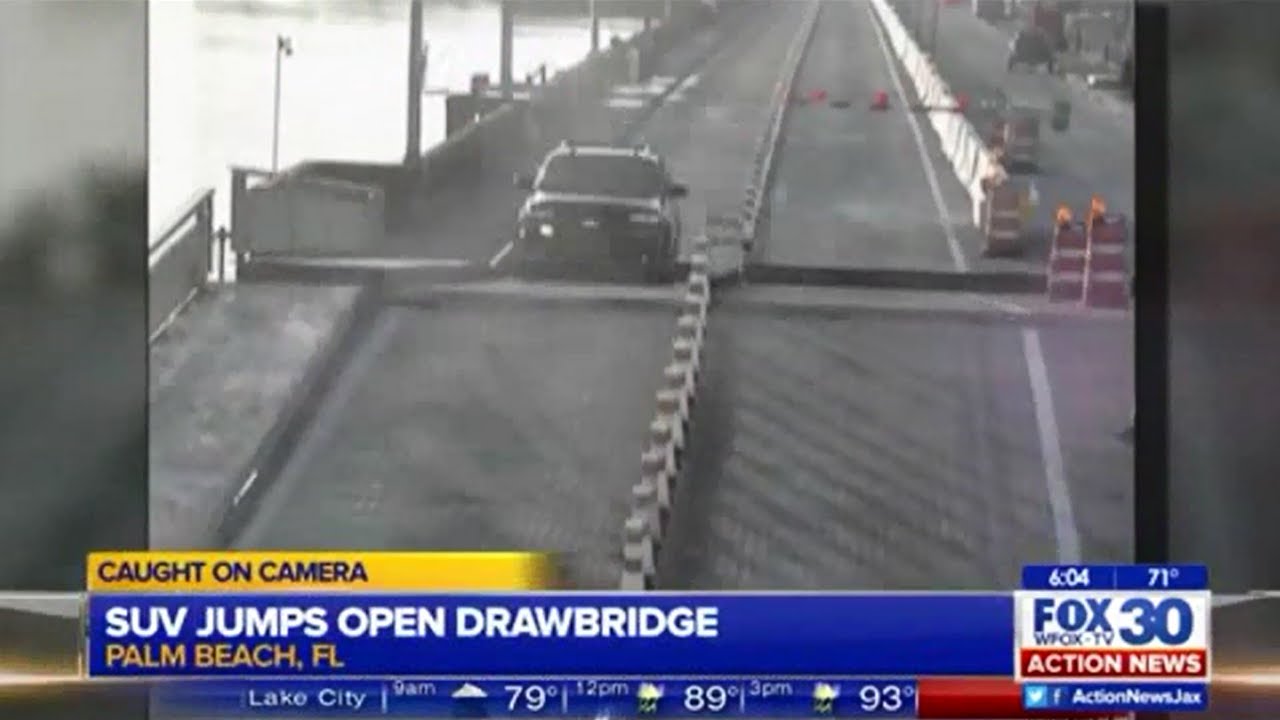 Speeding SUV driver jumps bridge as it rises - YouTube