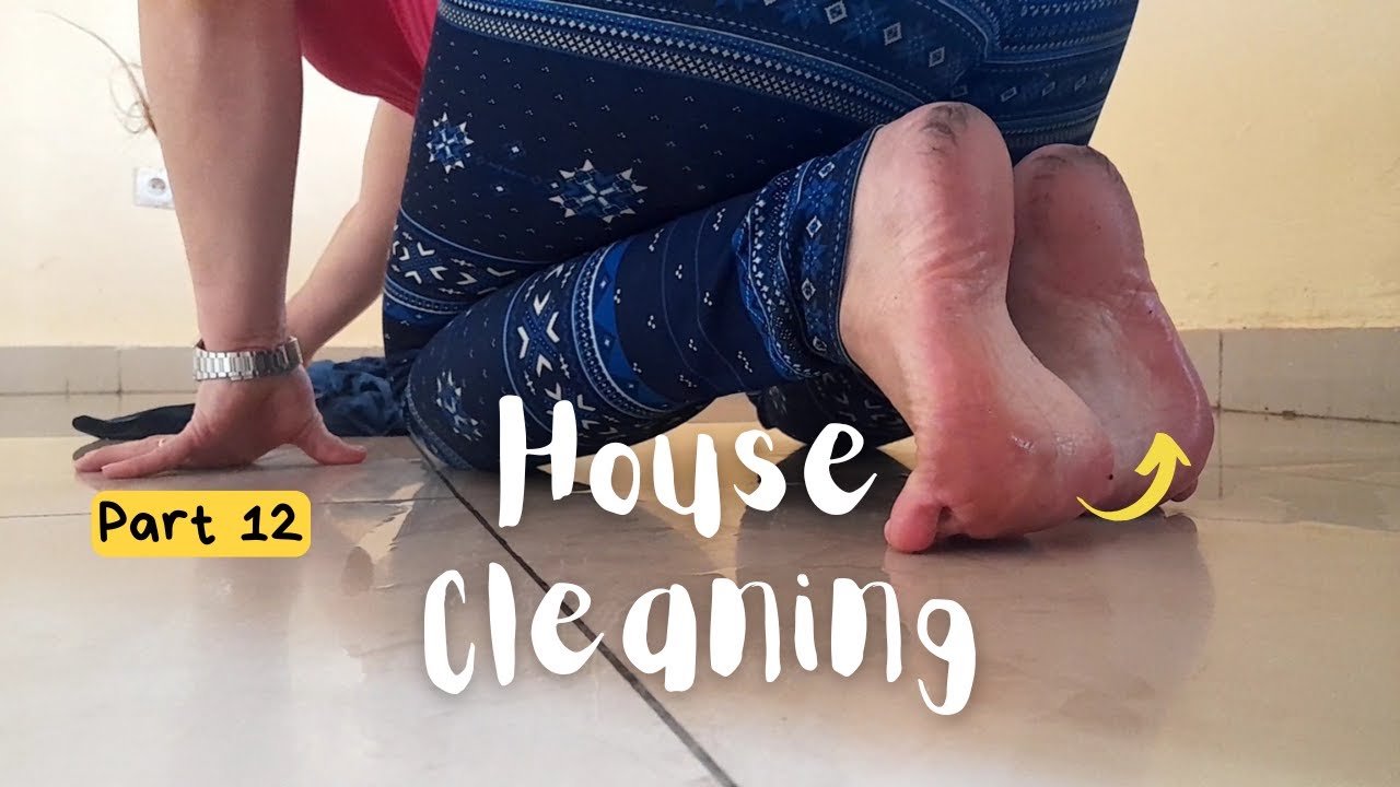 Cleaning living room tiles barefoot