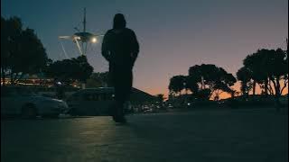 Man walking in street and sunset - Copyright Free Video