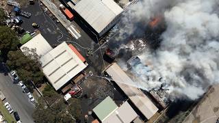 Metal recycling complex fire - Villawood
Fire and Rescue NSW (FRNSW) crews have been battling a large fire in a metal recycling complex in Villawood.
FRNSW received multiple Triple Zero (000) calls to a fire just after 12.30pm 21 Oct 2024 and firefighters observed large volumes of thick black smoke en route to the incident.
Large quantities of mattresses shredded for disposal are well alight, and the fire is deep within multiple areas in the facility.
More than 60 firefighters are on scene, with over 16 fire trucks including numerous aerial ladder trucks.
Firefighting efforts are being hampered by water supply issues and strong winds are pushing smoke in a northerly direction.
FRNSW is urging nearby residents to stay away from the area and keep doors, windows and vents closed.
Local evacuations are in place, and there are no reported injuries.
Miller Road and Sir Thomas Mitchell Road are currently closed.
NSW Police and NSW Ambulance are also in attendance. Metal recycling complex fire - Villawood