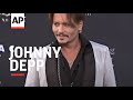 Orlando Bloom and Jerry Bruckheimer defend Johnny Depp at “Pirates” Hollywood premiere, young stars