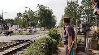 The work of the train controller at the railway crossing