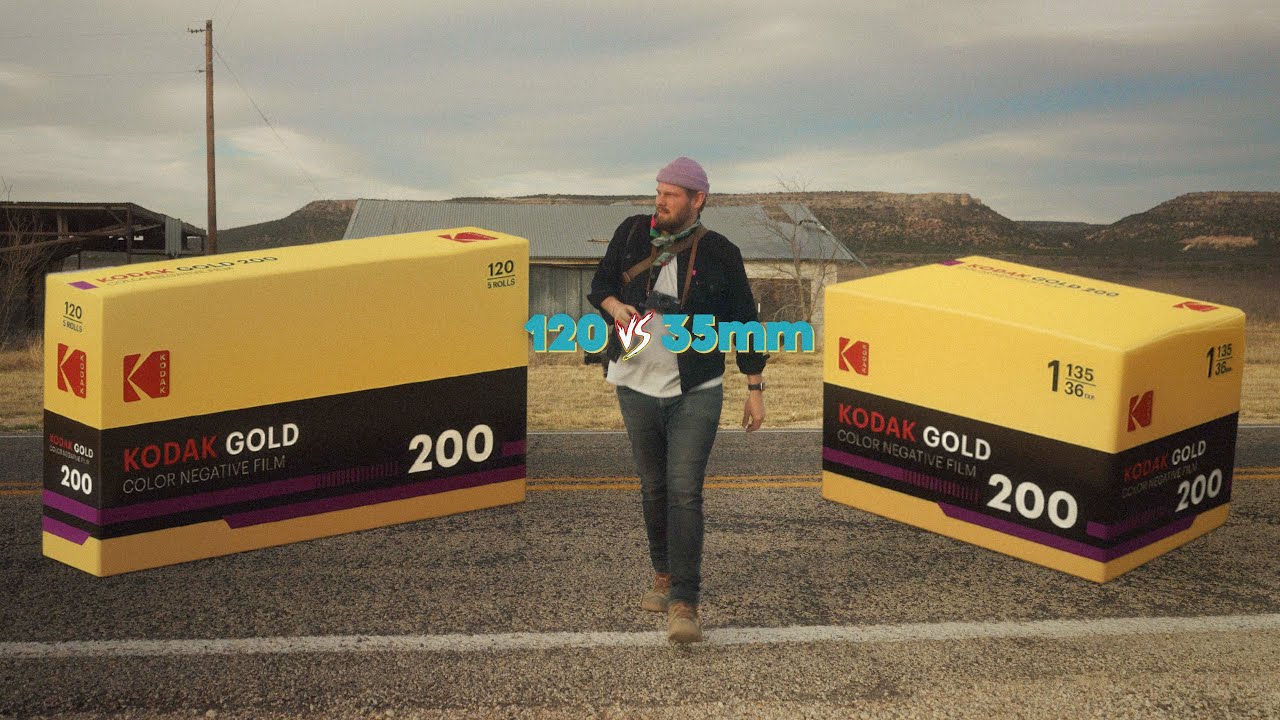 a man walking across the street with film boxes next to to him