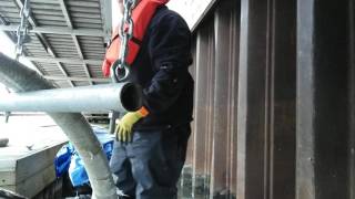 PLUMBERS CONNECTING BUILDING WATER SUPPLY TO MARINA DOCK