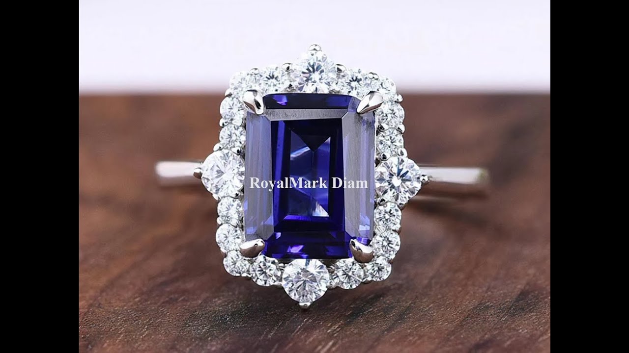 7x9mm Emerald Cut Blue Sapphire Halo Engagement Ring in 10k Yellow Gold for Michelle McGown