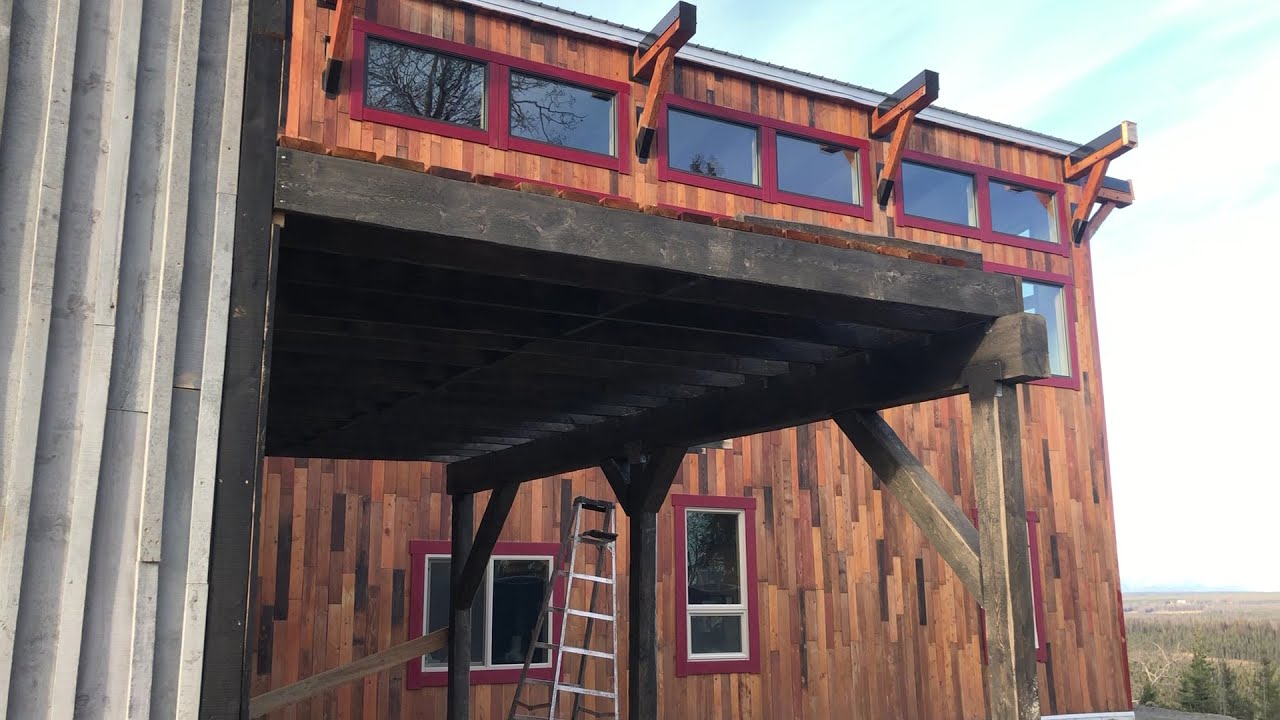 Rough cut Alaska spruce deck off greenhouse- the first deck I have ever built!