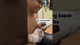 Seorang Bapak Menyusui Bayinya...