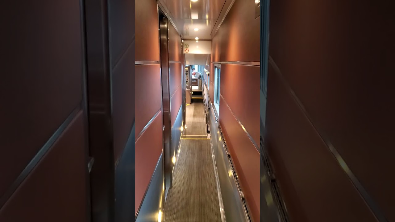 The Canadian VIA Rail Train Walking Down Prestige Sleeper Car to Park Car Lounge