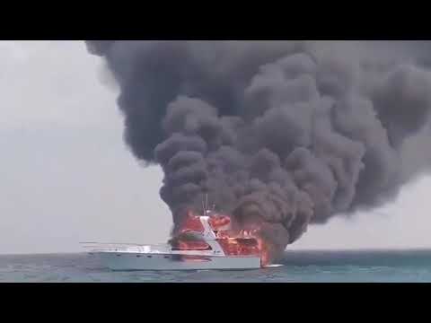 Family forced to dive into ocean as their boat went up in flames