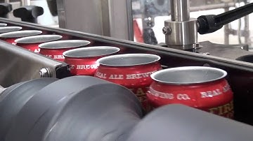 Dây chuyền đóng lon nước có gas Comac