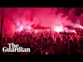 Thousands of olympiakos fans celebrate in streets after europa conference league win