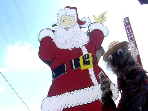 Giant Santa Claus in Christmas Michigan with Willy the Weasel