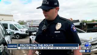 Aurora officers narrowly avoid being hit by suspected drunk driver