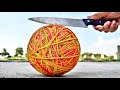 CUTTING 50,000 RUBBER BAND BALL