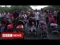 Record surge in migrants attempting to cross US-Mexico border - BBC News