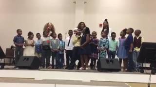 Mrs. Holland's 1st Grade Superstars sings w/Virtue