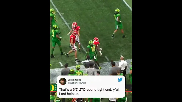 Georgia's Darnell Washington is hurdling defenders...