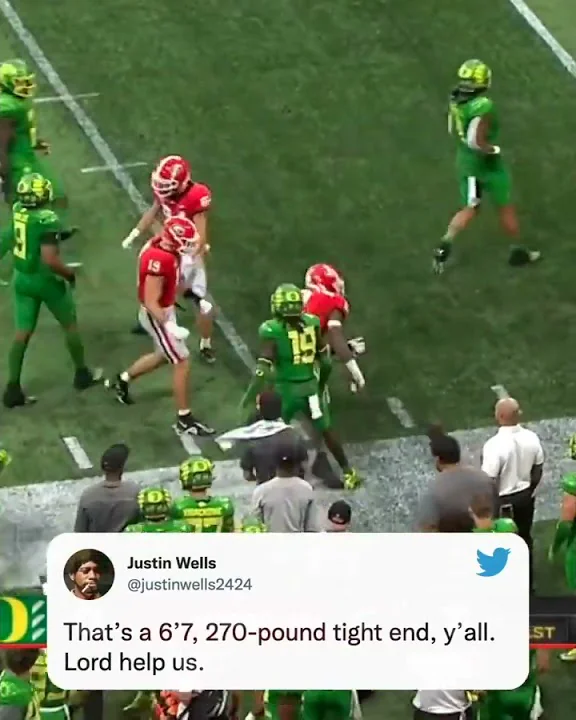 Georgia's Darnell Washington is hurdling defenders...
