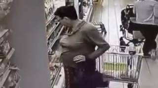 Crazy woman takes a pee in the store