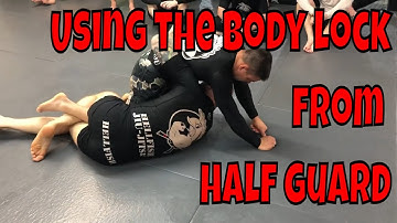 Using the body lock from bottom half guard to sweep