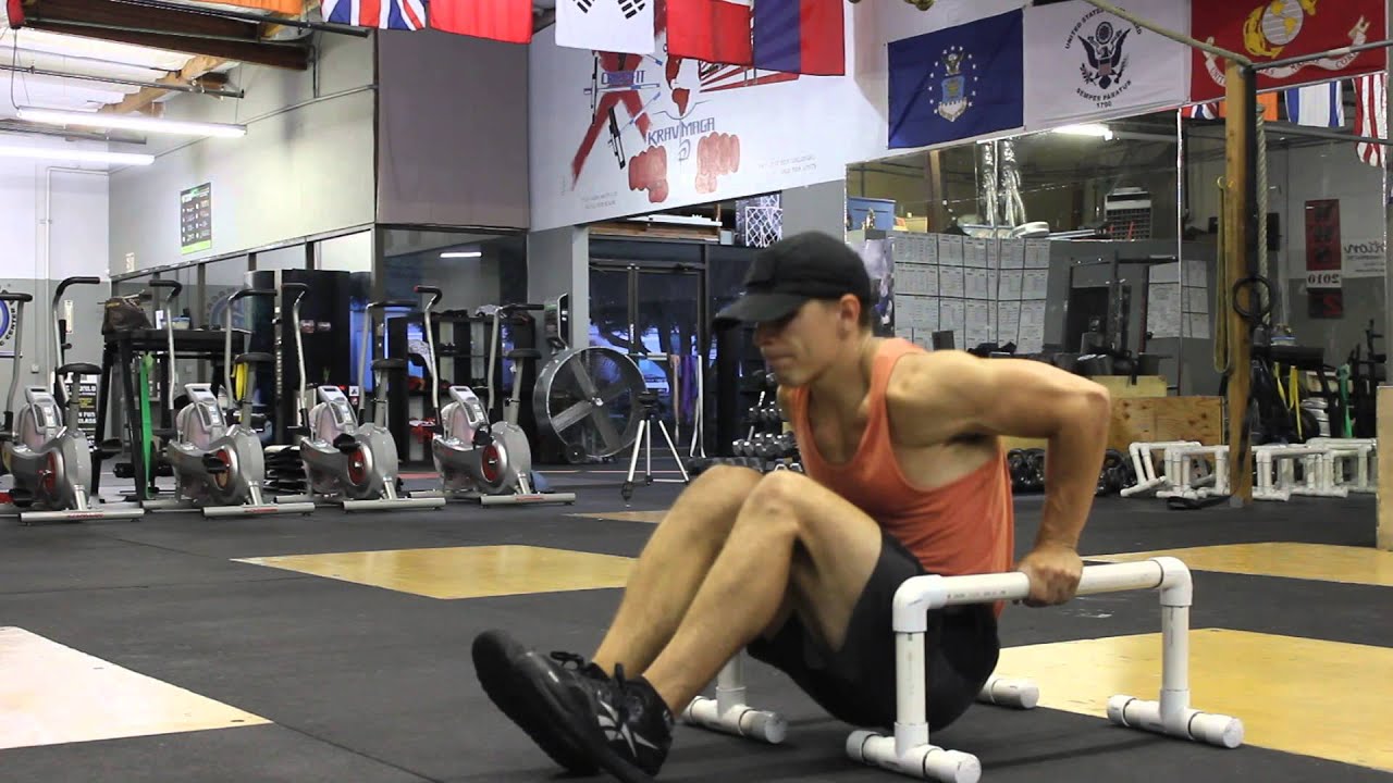 Parallete Dip Knees bent. Gradually get to the point where your legs