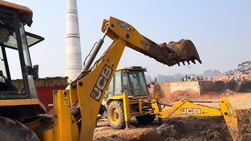 JCB 3dx Backhoe soil loading with a SONALIKA tractor