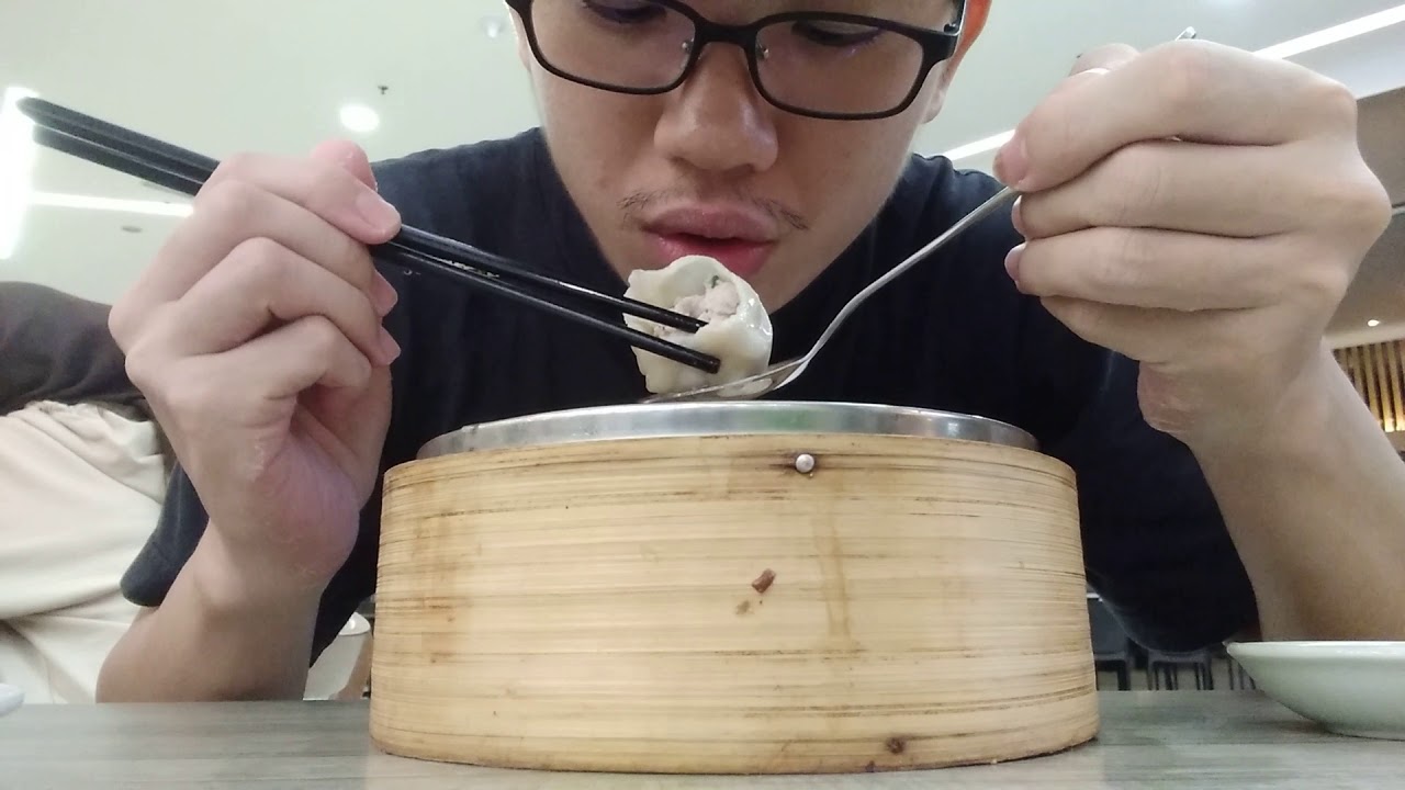 Eating a traditional Chinese delicacy, Xiao Long Bao in Setapak central