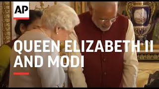 Queen and Modi look at palace artefacts