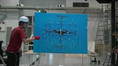 UAV with Two Passive Rotating Hemispherical Shells for Physical Interaction and Power Tethering