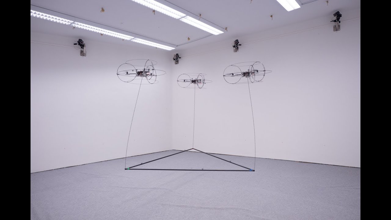 Cooperative  transport with fully-actuated tricopters and heavy ropes