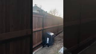 Custom motorized sliding gate with cedar privacy fence install in Dallas, TX