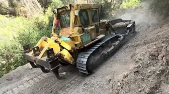 FOREST ROAD WIDENING AND REMOVAL WORKS WITH A Caterpillar D7G ROAD TRACTOR